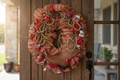 Cowboy boot western wreath with burlap mesh and red bandana ribbon hanging on a rustic front door